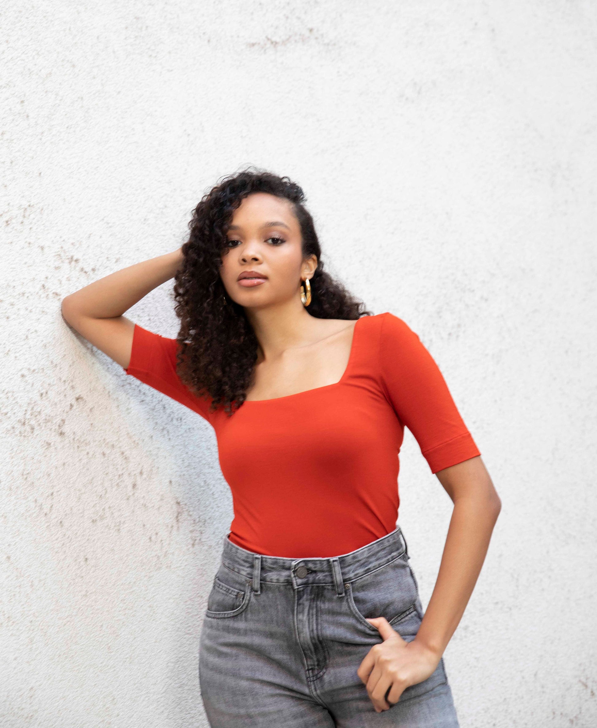 MIA square-neck top styled with jeans, tucked in, front view, burnt red