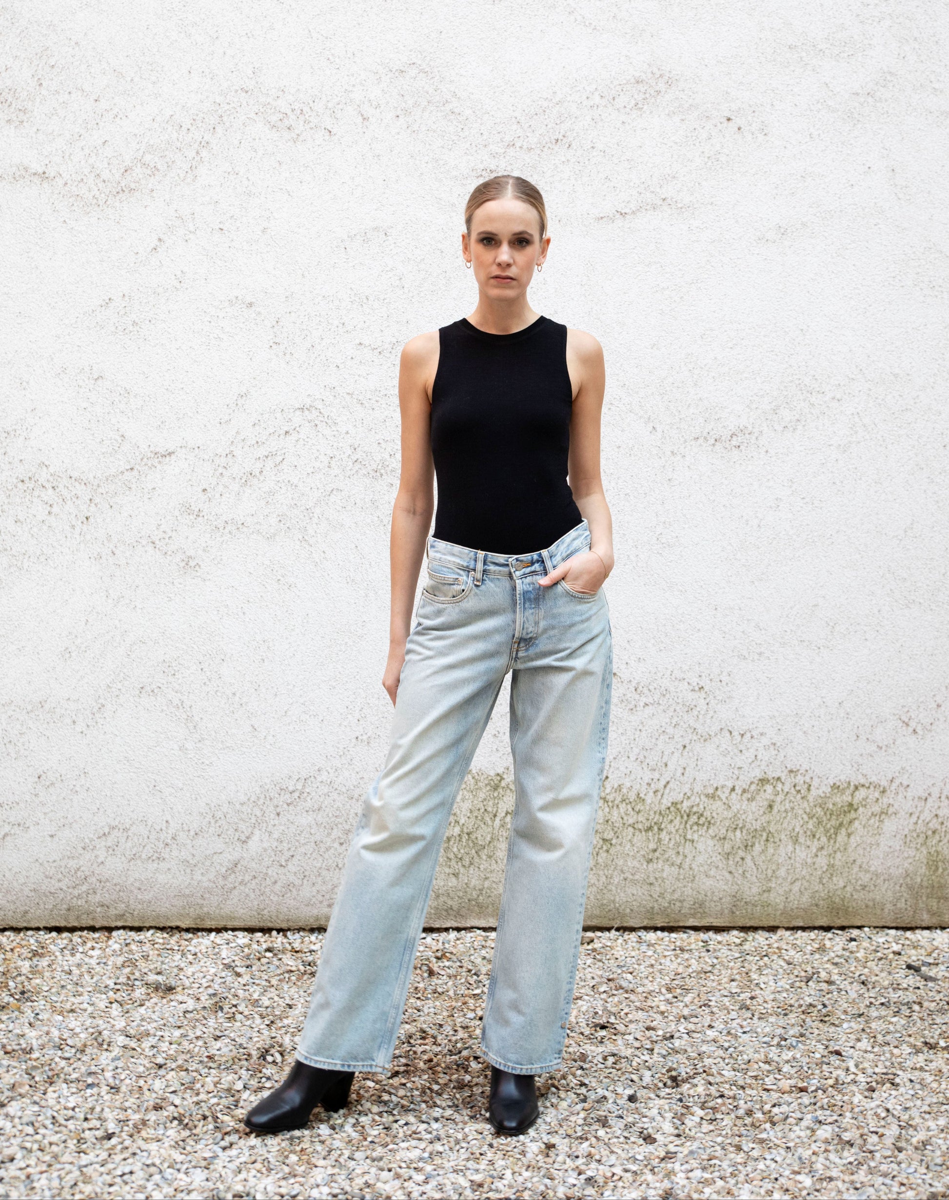 CLEO seamless tank bodysuit styled with jeans and boots, A-frame, front view, black