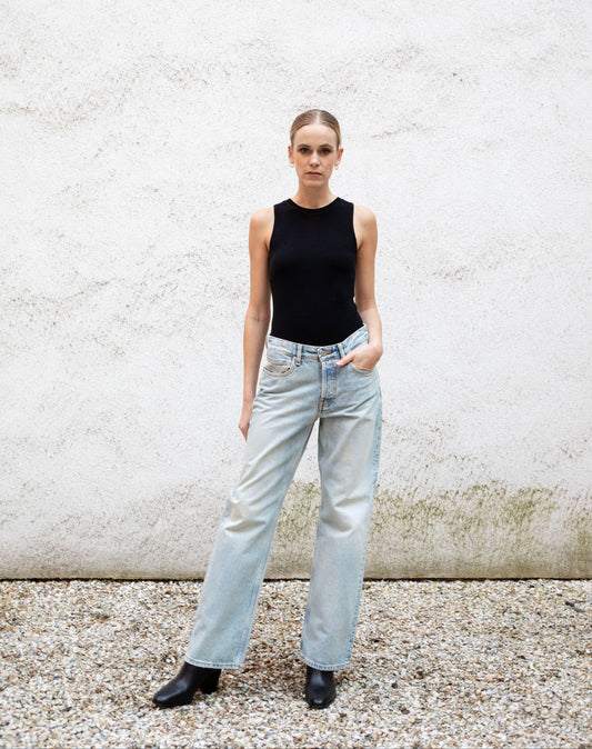 CLEO seamless tank bodysuit styled with jeans and boots, A-frame, front view, black