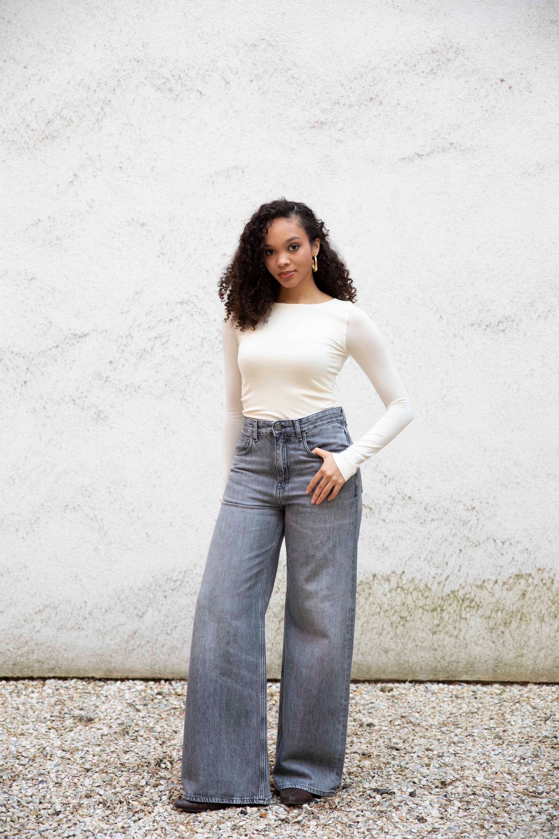 VALENTINA boatneck top with seamless bodice, tucked into jeans with boots, front view, bright cream