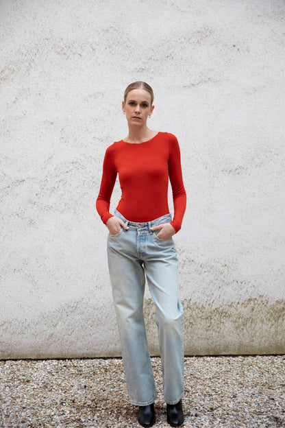 VALENTINA boatneck top styled with jeans and boots, front view, burnt red