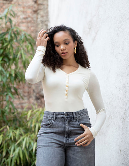 MARA V-neck bodysuit styled with jeans, front view, bright cream