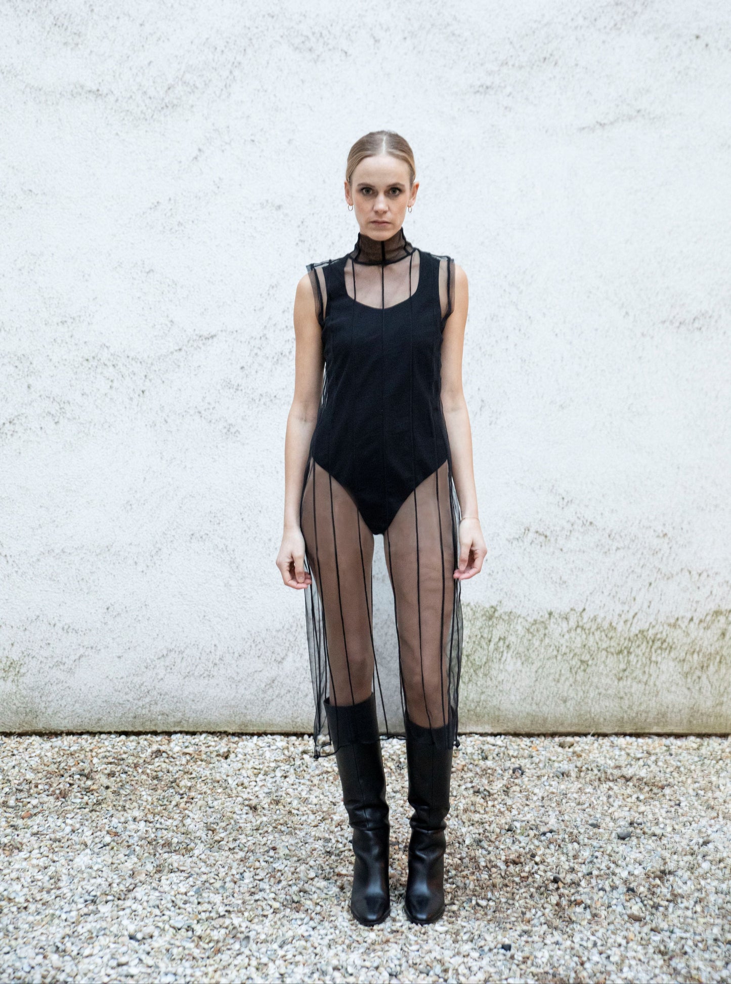 EMMI sweetheart-neck bodysuit styled with transparent dress and boots, front view, black